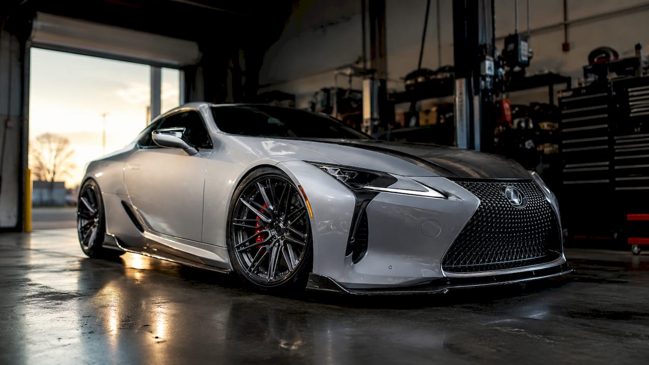 Close-up of Lexus LC500 front splitter and side skirts