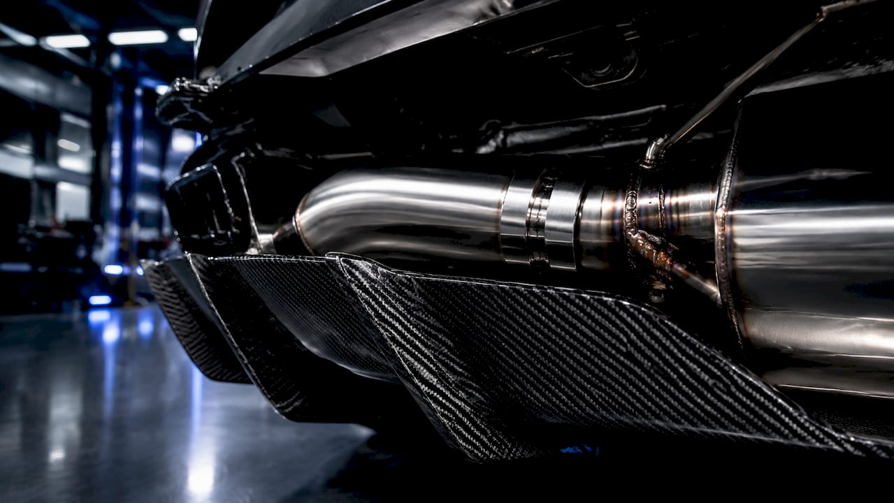 Technical close-up of Lexus LC500 stainless steel exhaust