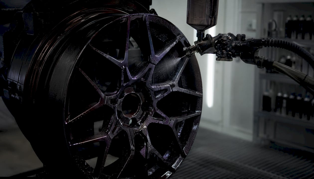 Close-up of Lamborghini wheel with liquid paint spray detail
