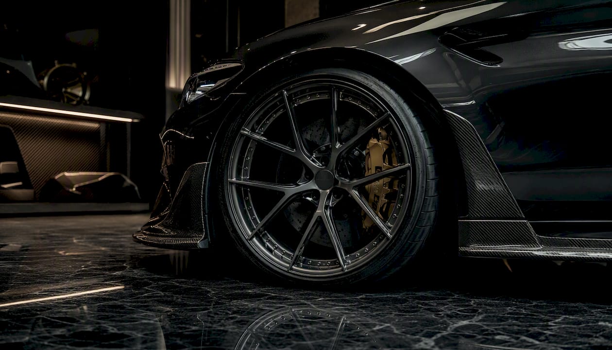 Close-up of BMW M5 forged wheel with carbon fiber