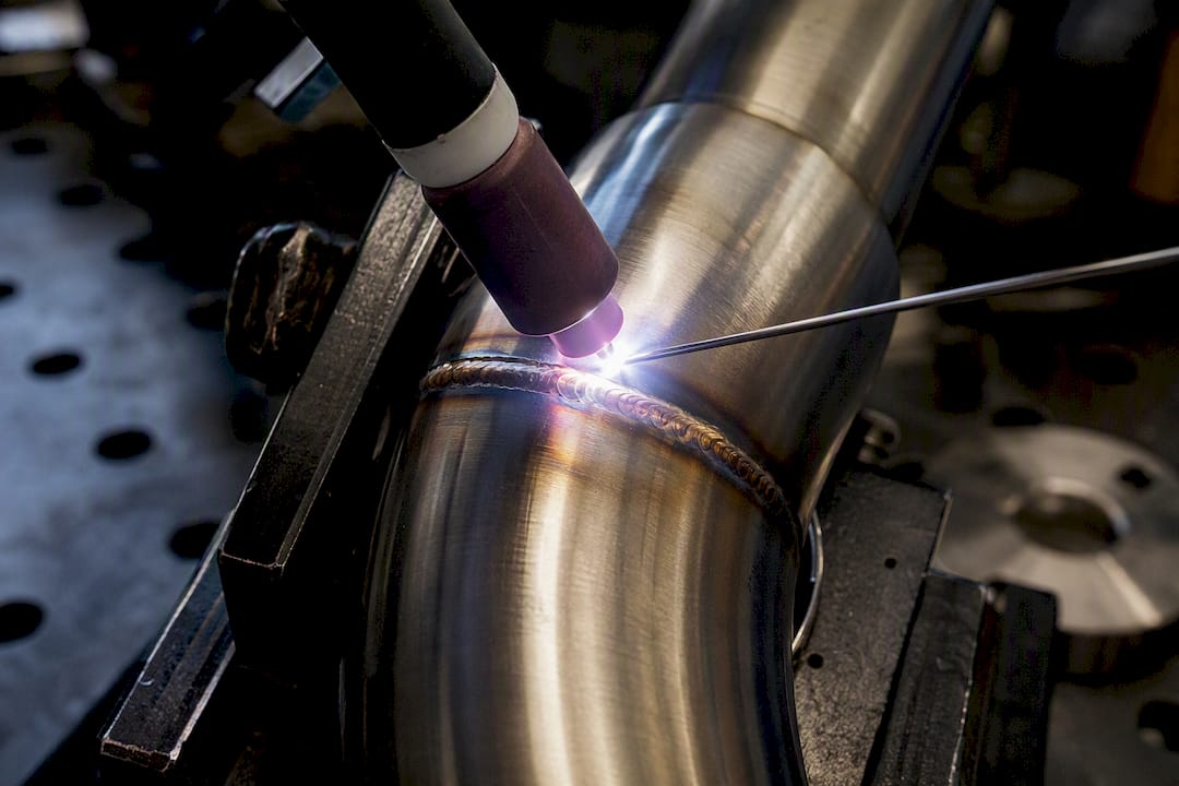 TIG welding stainless steel downpipe close-up