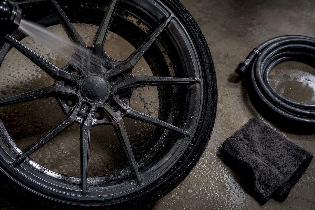 Cold water rinsing brake dust from wheel