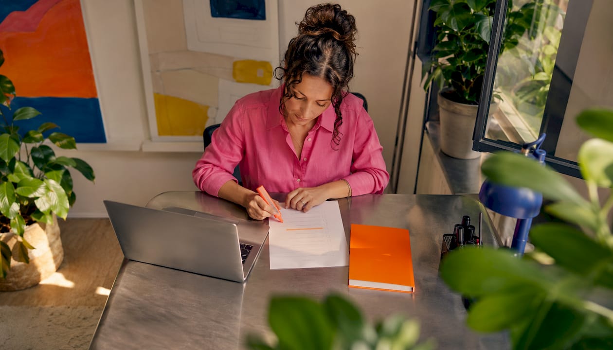 Hands reviewing translator credentials checklist