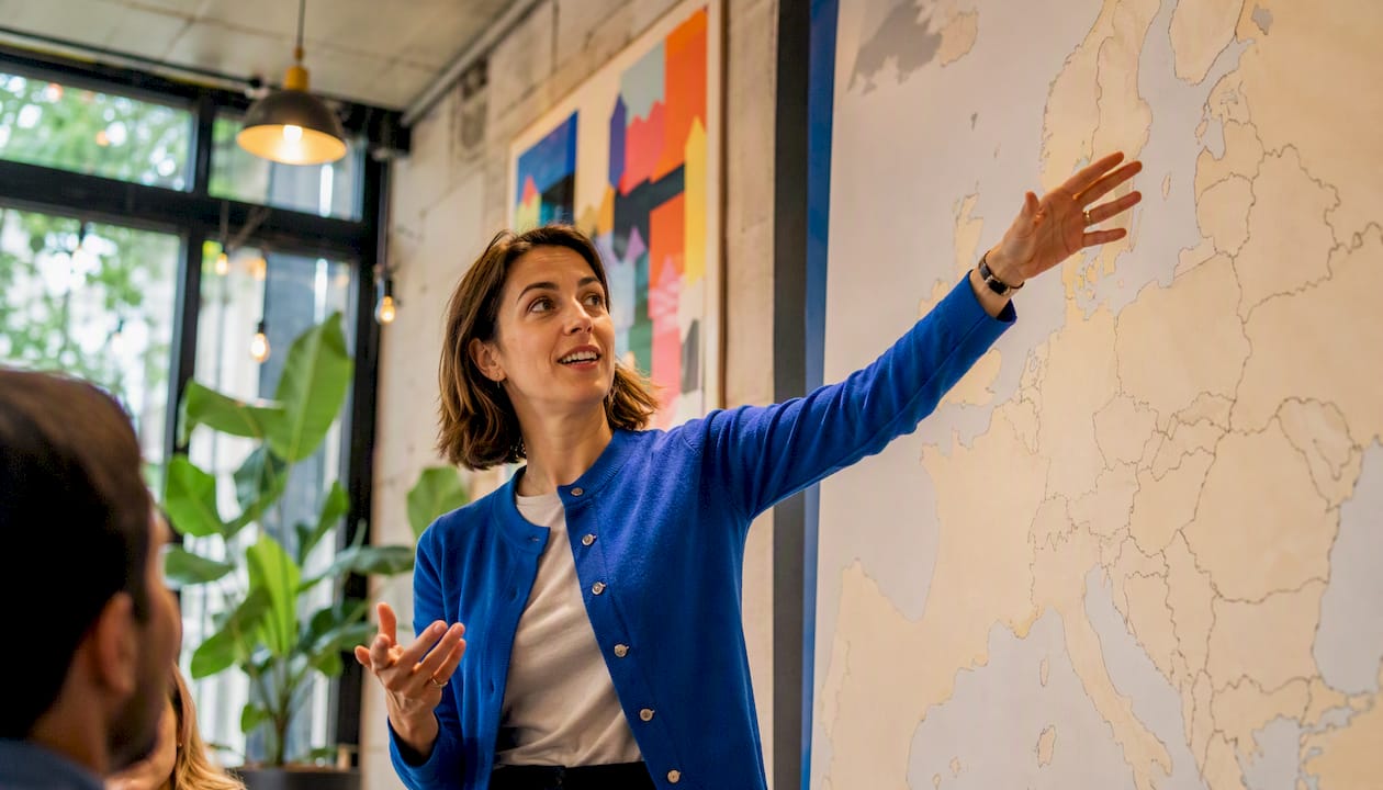 Professional pointing at map symbolizing local insights