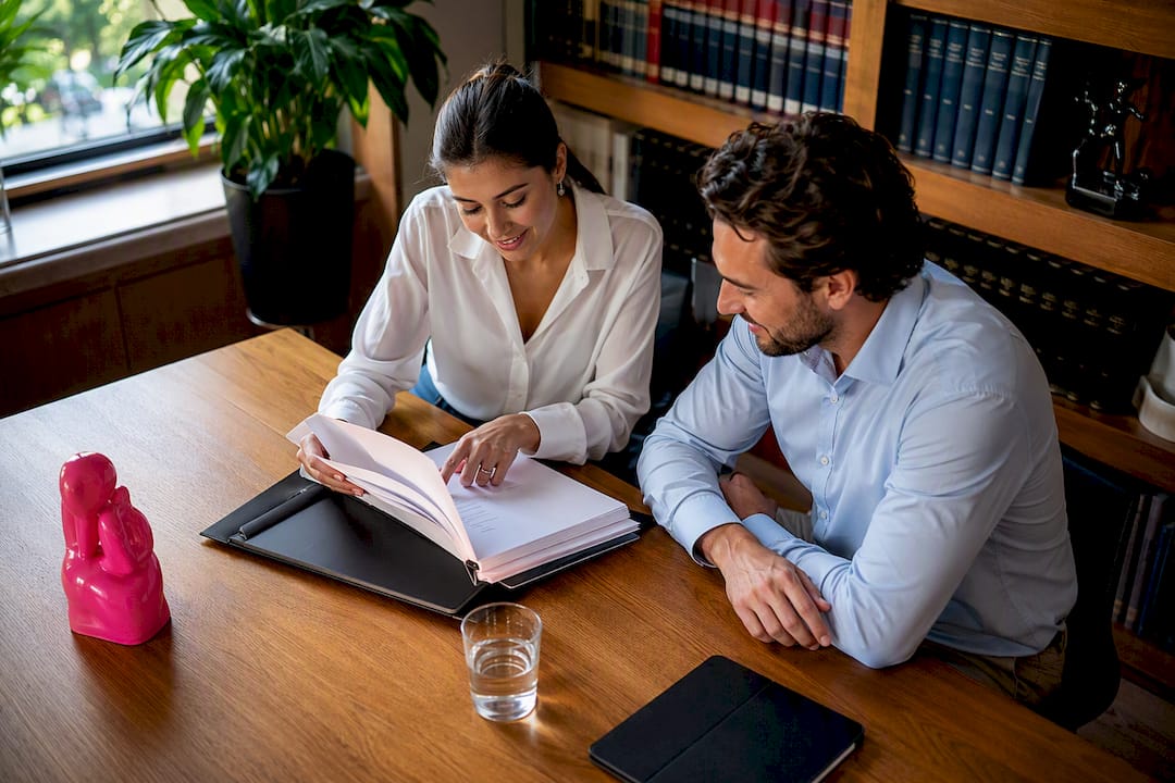 Interpreter and solicitor conducting pre-hearing briefing