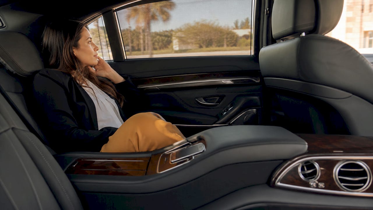 Interior of luxury airport limousine with passenger