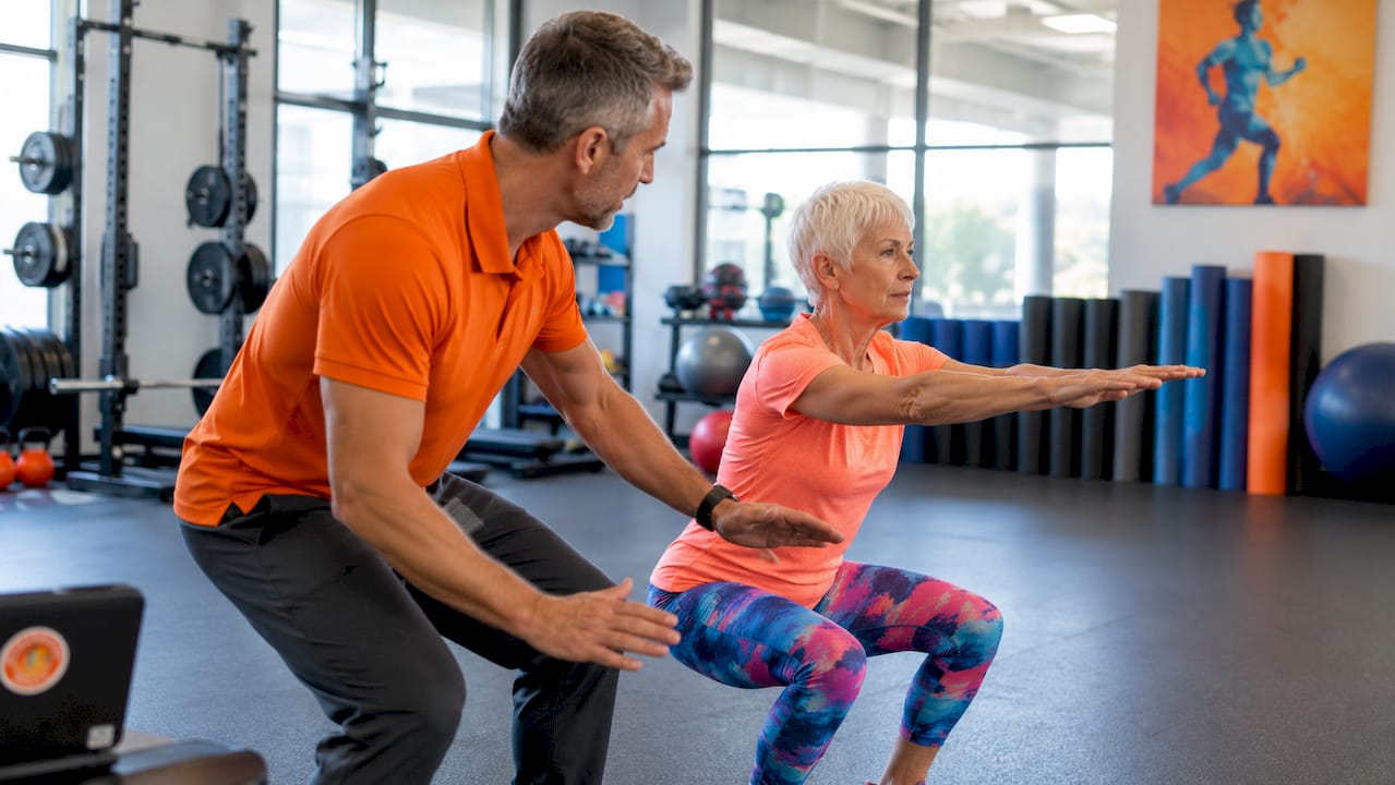 Therapist coaching patient on prehabilitation exercise