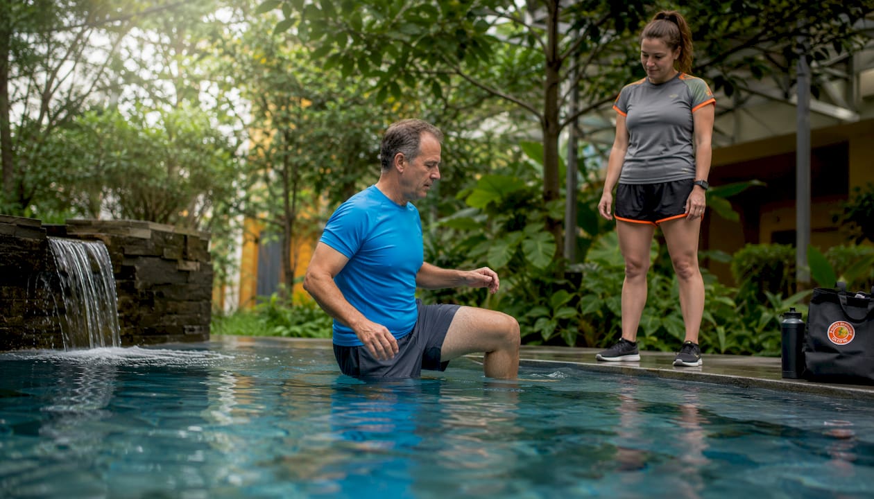 Patient doing knee rehab in hydrotherapy pool