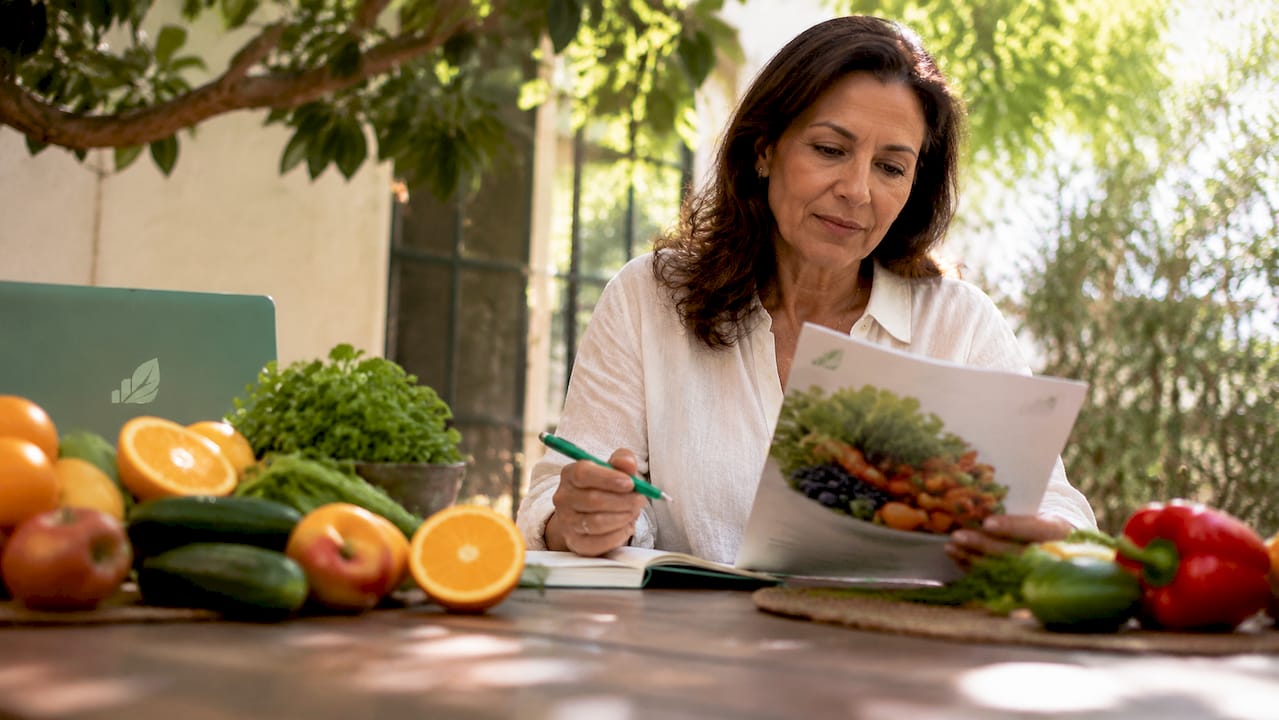 Nutritionist reviewing antioxidants and fresh foods
