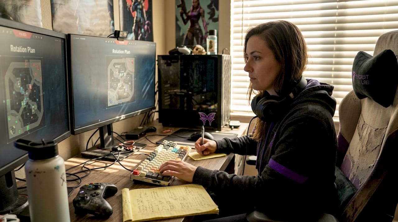 Gamer analyzing strategy on home monitors