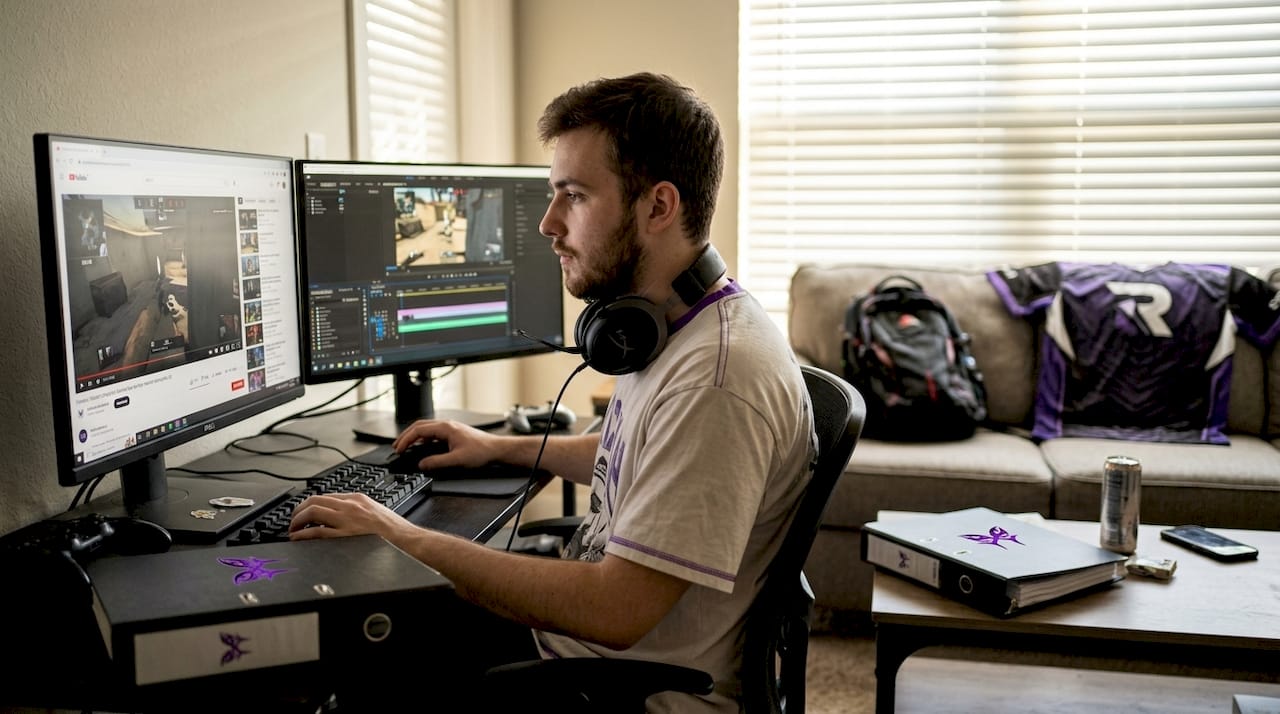 Esports player analyzing gameplay clips at home