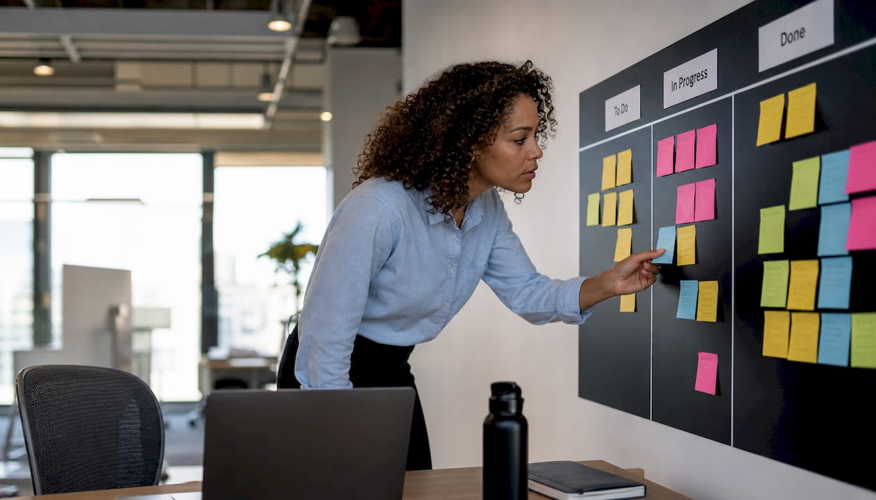 Developer reviewing Kanban board workflow
