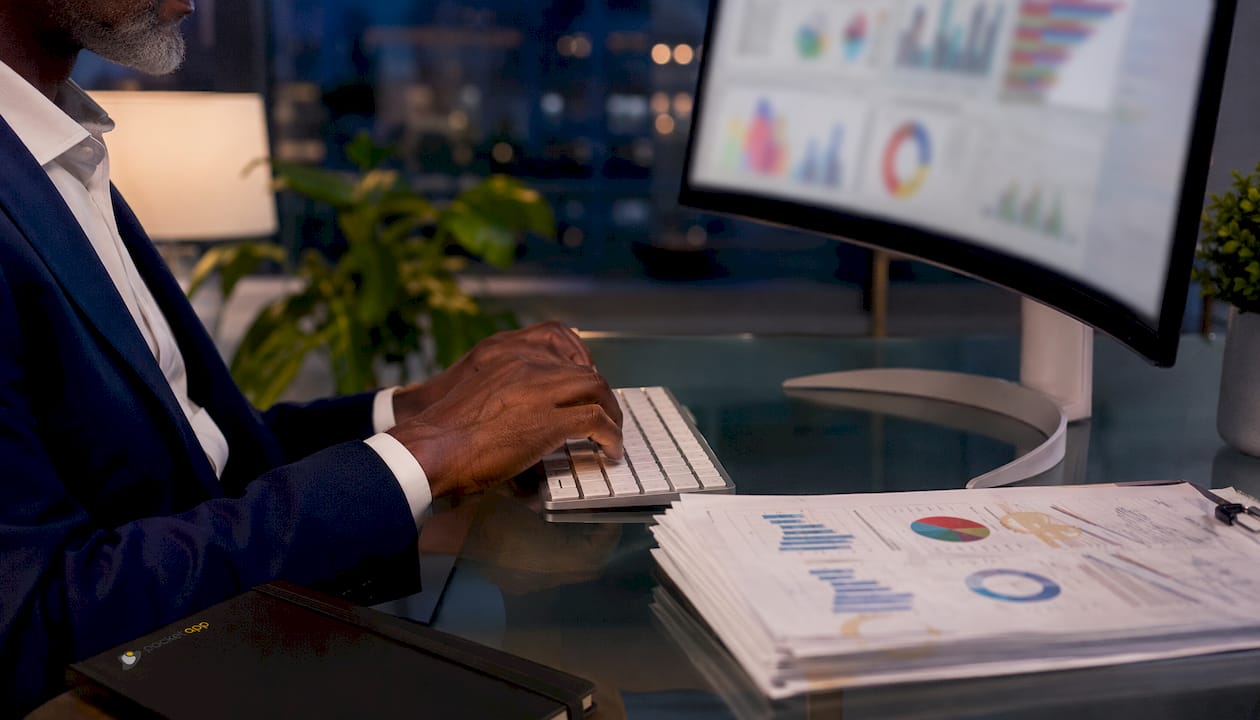 Hands typing on keyboard for AI retail analytics