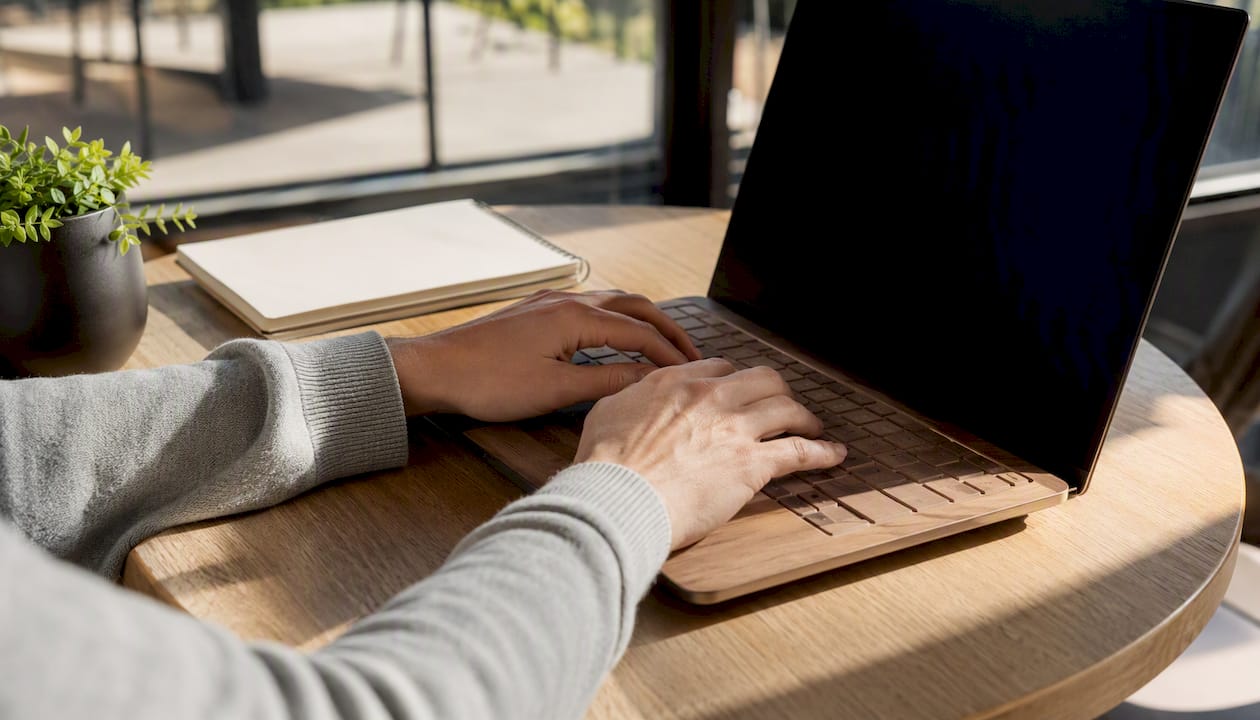 Developer hands focused on laptop keyboard