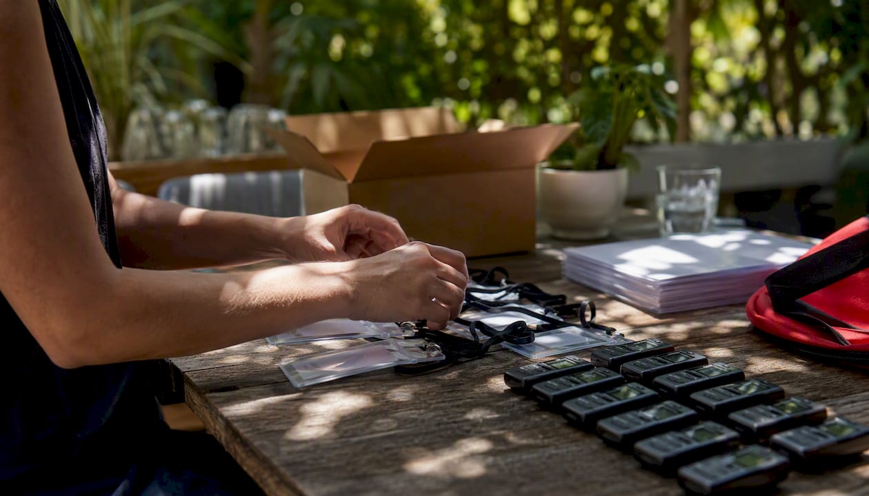 Hands preparing recruitment materials