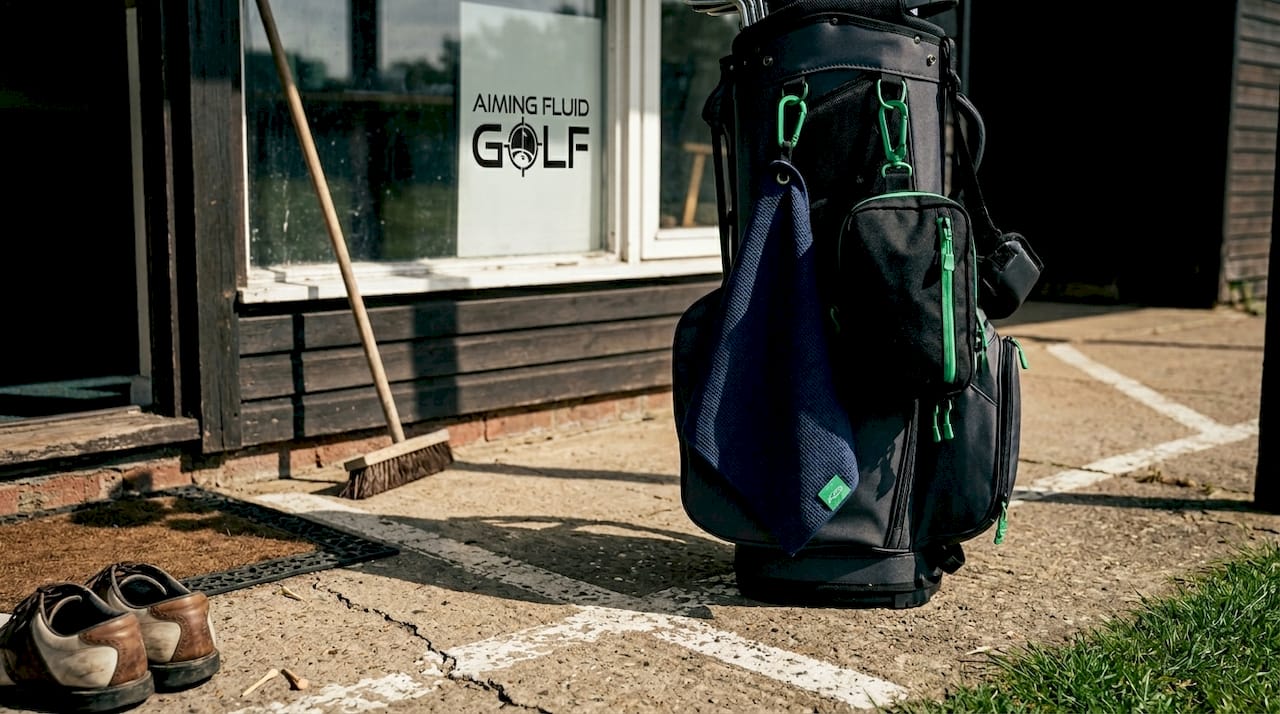Modular golf bag with magnetic towel and pouch