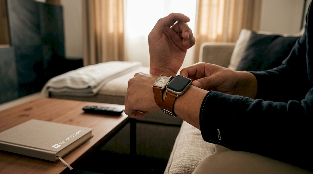 Person adjusting Cartier and Apple Watch double strap