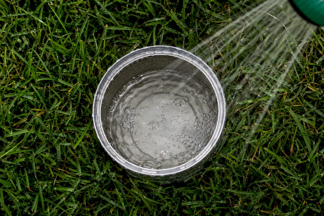 Can measuring water on Calgary lawn