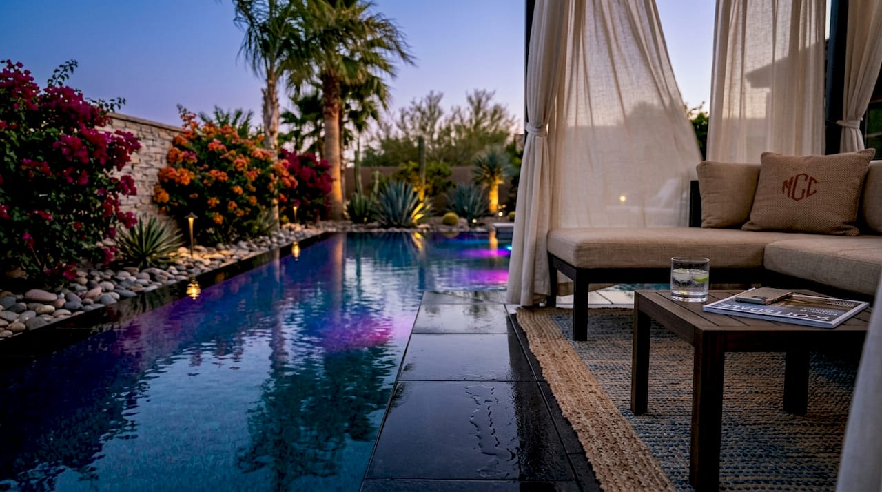 Luxury Phoenix pool with LED lighting at dusk