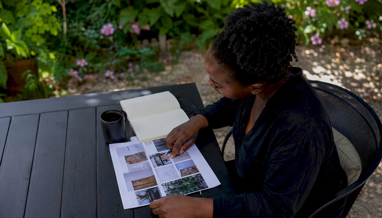 Hands reviewing contractor references in kitchen