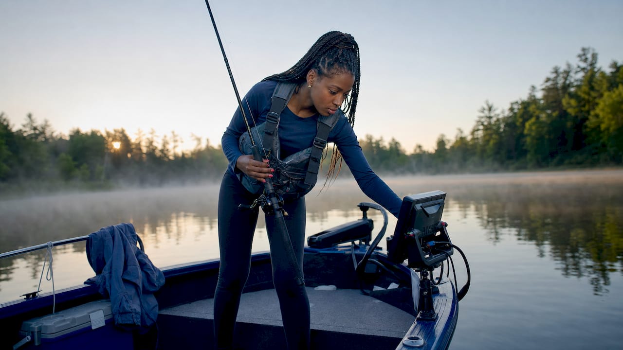 Woman fishing on lake employing thermocline techniques