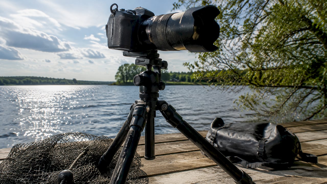 Camera setup closeup on dock by fishing rod