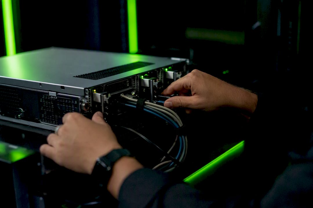 Hands inspecting financial transaction server hardware