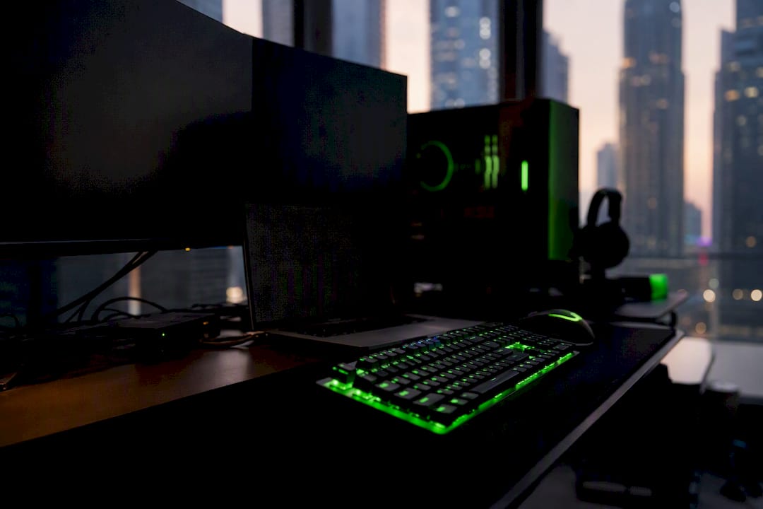 Gaming-themed developer desk with dark screens