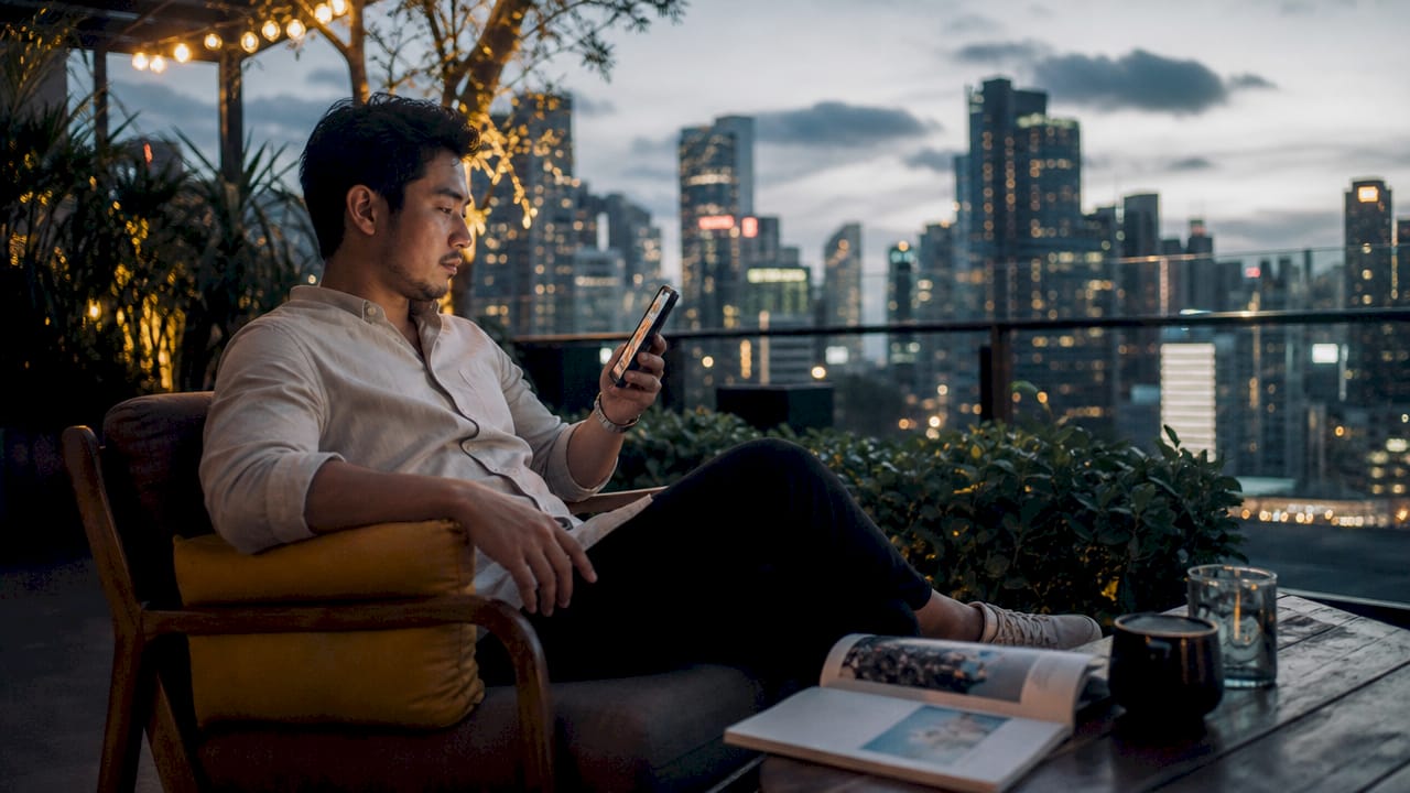 Employee relaxing on hotel balcony during trip