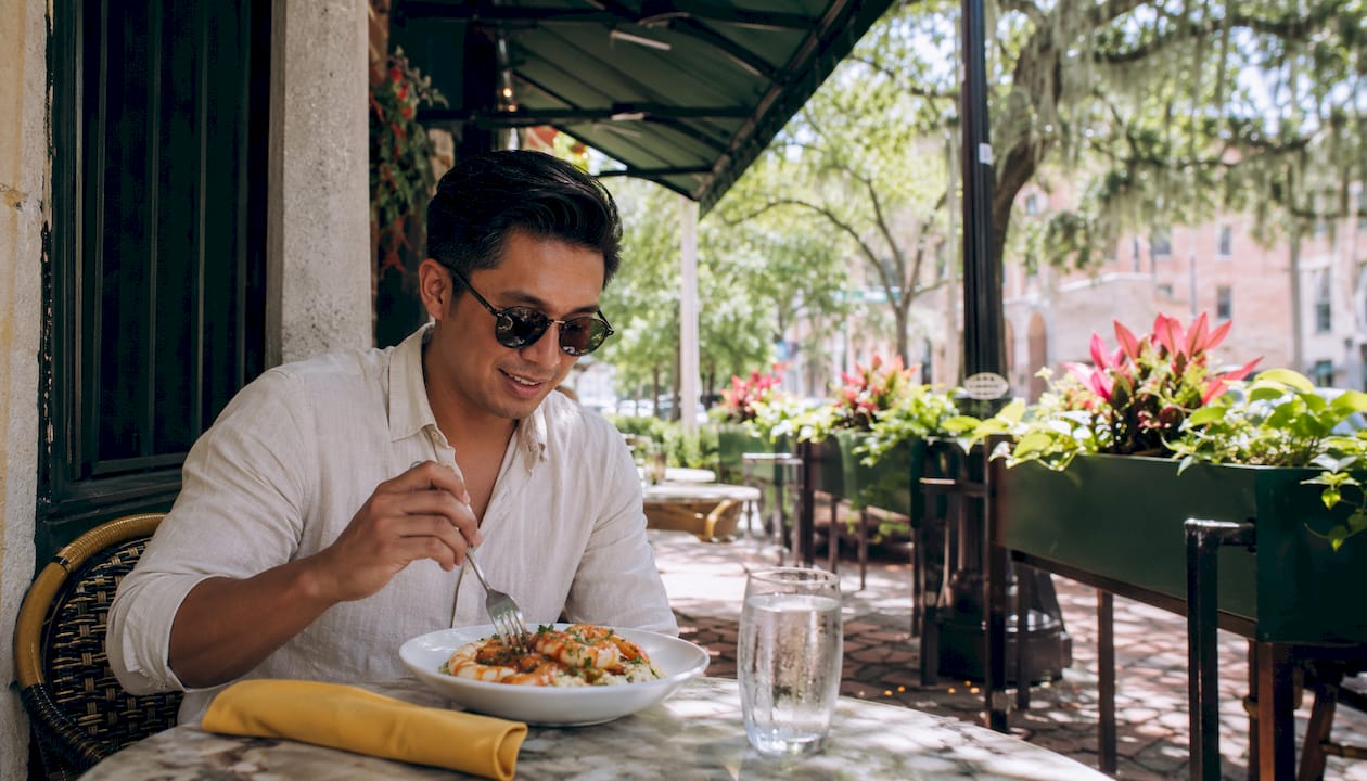 Man dining outdoors in Savannah cafe