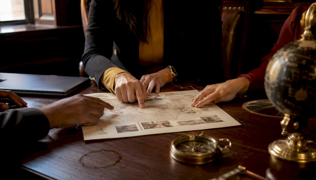 Hands planning bespoke philanthropic luxury trip