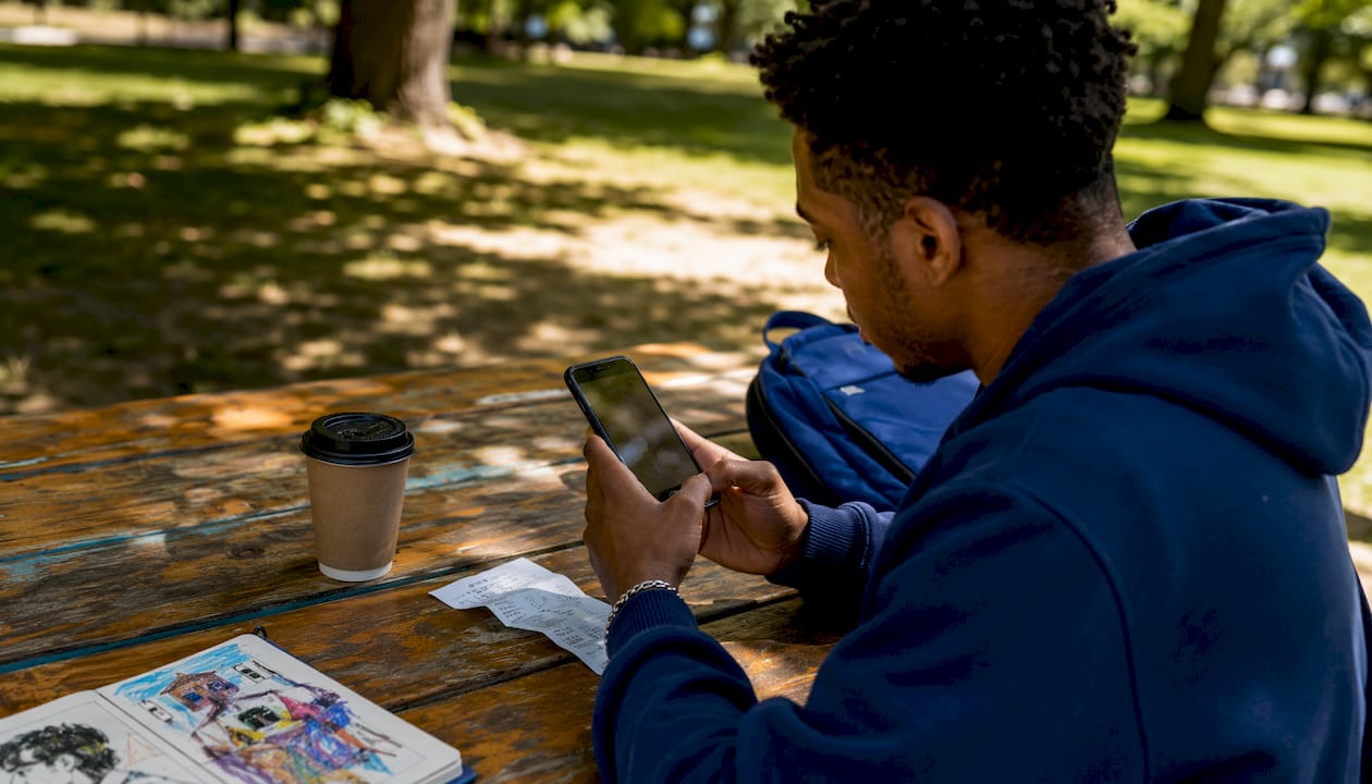 Hands capturing receipt photo with smartphone