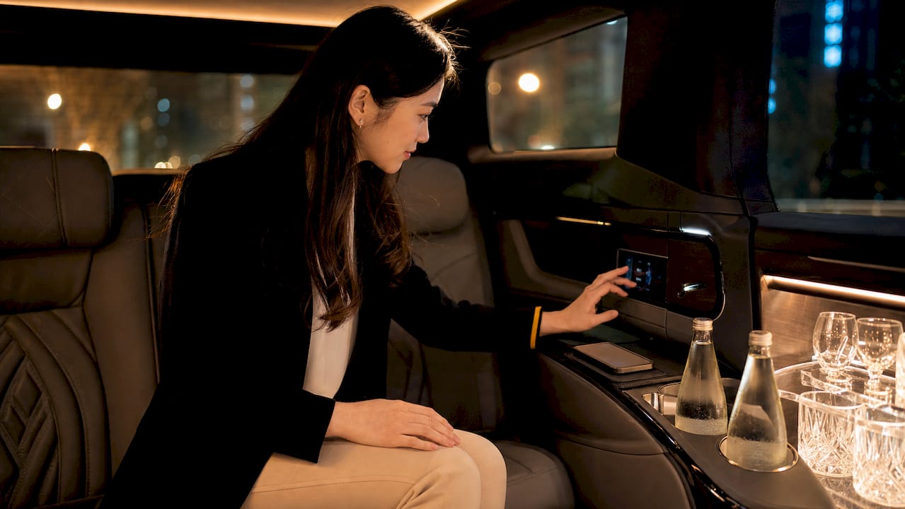 Passenger exploring limousine interior comforts