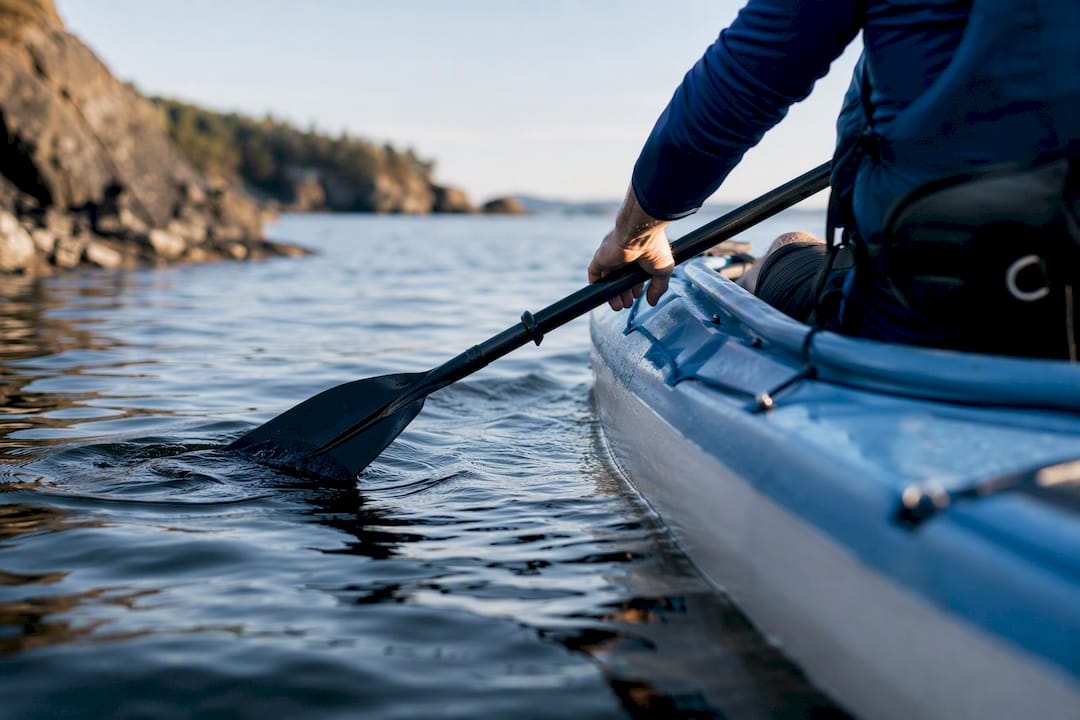 Paddler sitting toward back of kayak