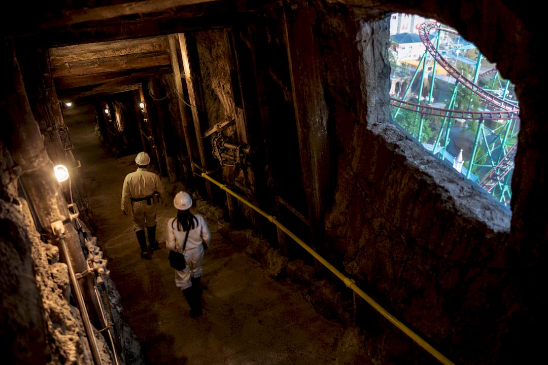Historic gold mine tunnel at Gold Reef City with mining artifacts