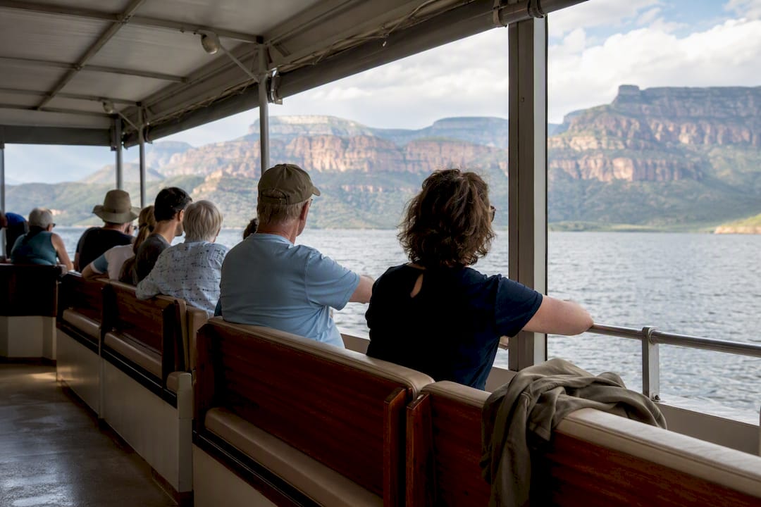 Outward-facing seating on covered cruise boat