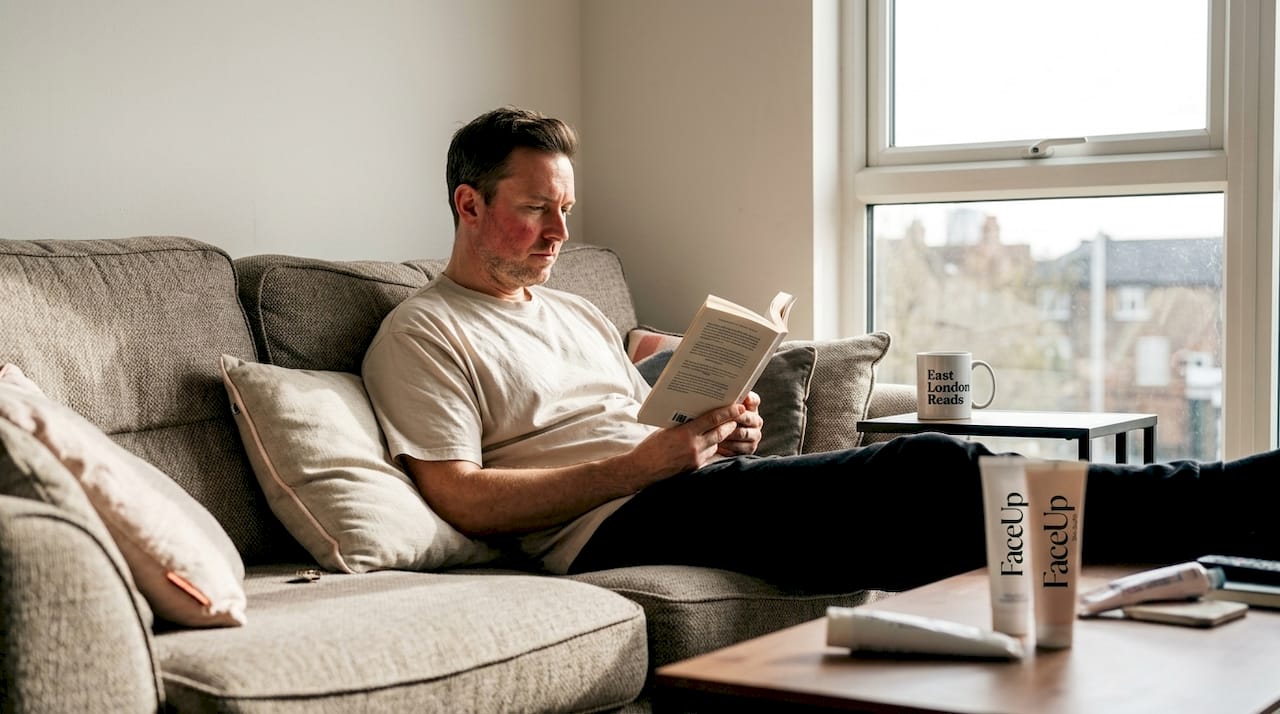 Man recovering from laser skin treatment at home