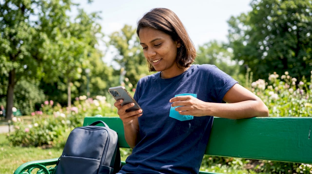 Person activating eSIM on smartphone