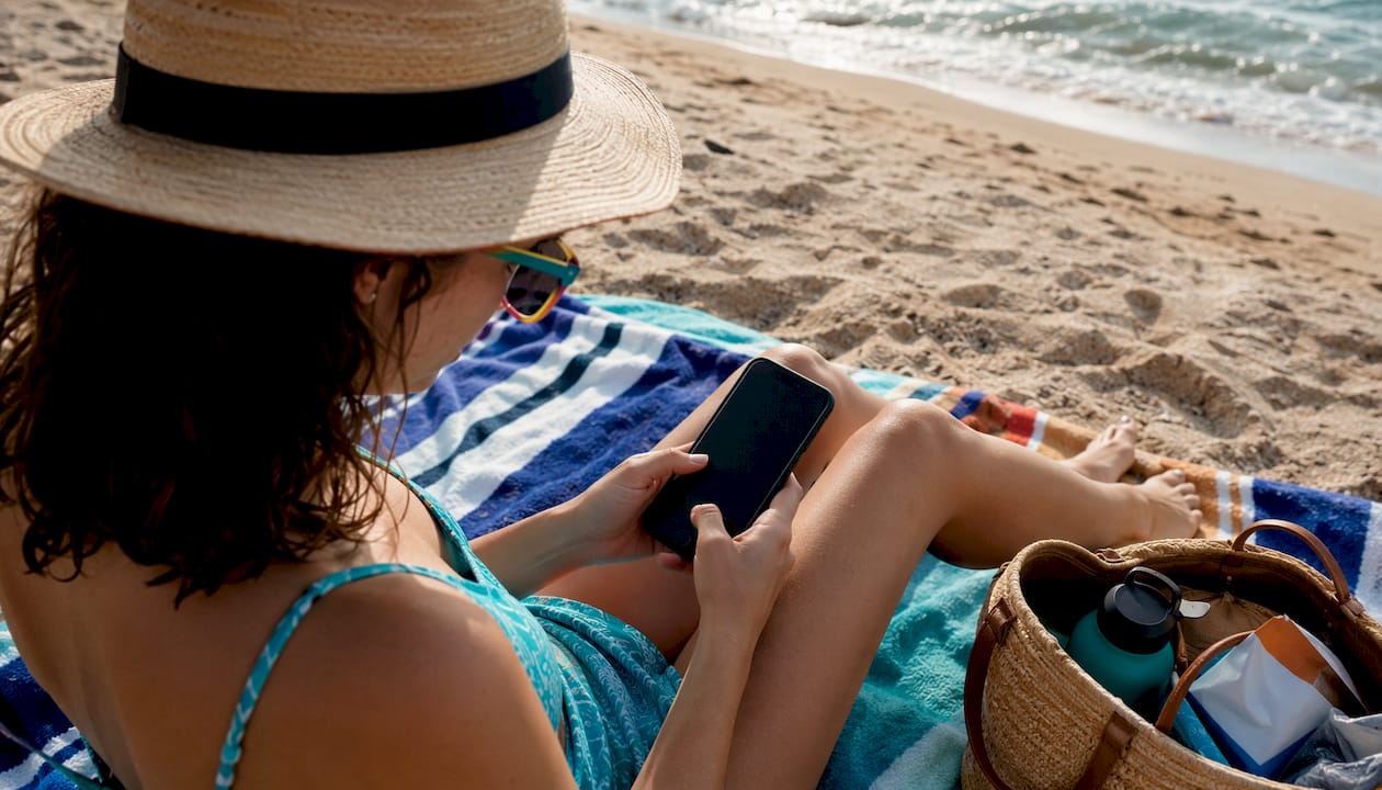 Woman using phone outdoor with Holafly data