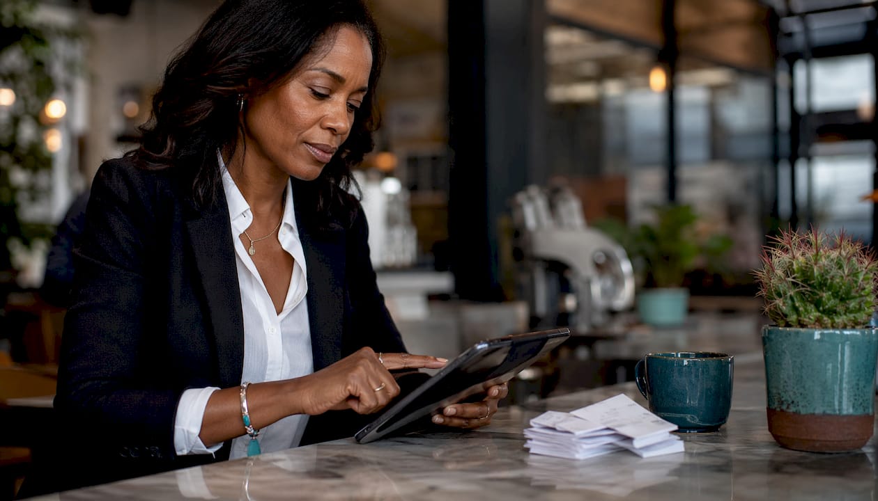 Woman using tablet to accept crypto payment