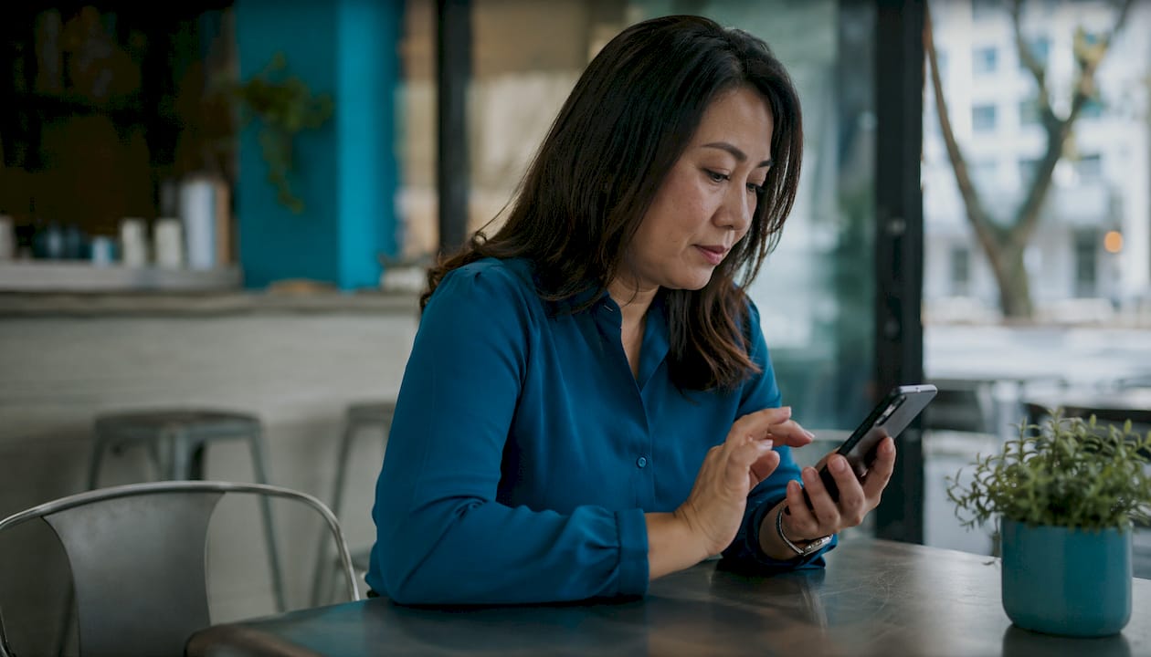 Woman managing mobile device security features