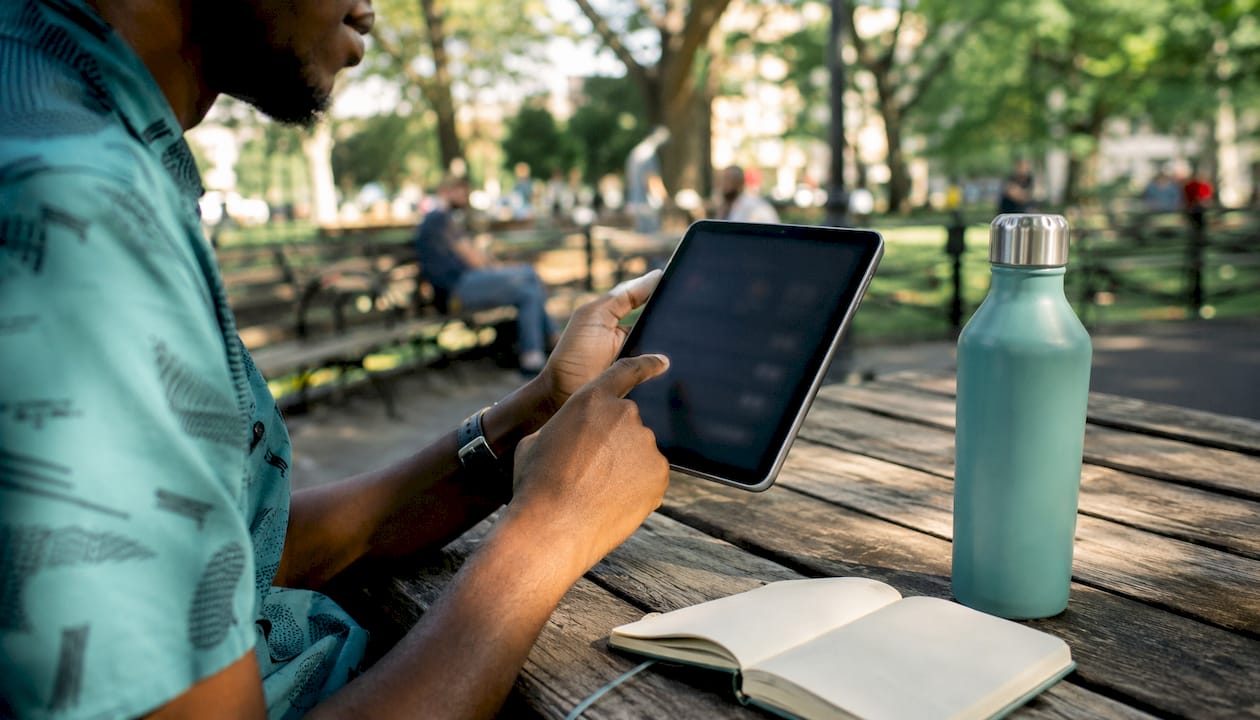 Hands making crypto payment on smartphone