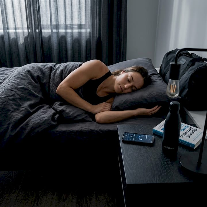 Athlete sleeping in calm bedroom for recovery