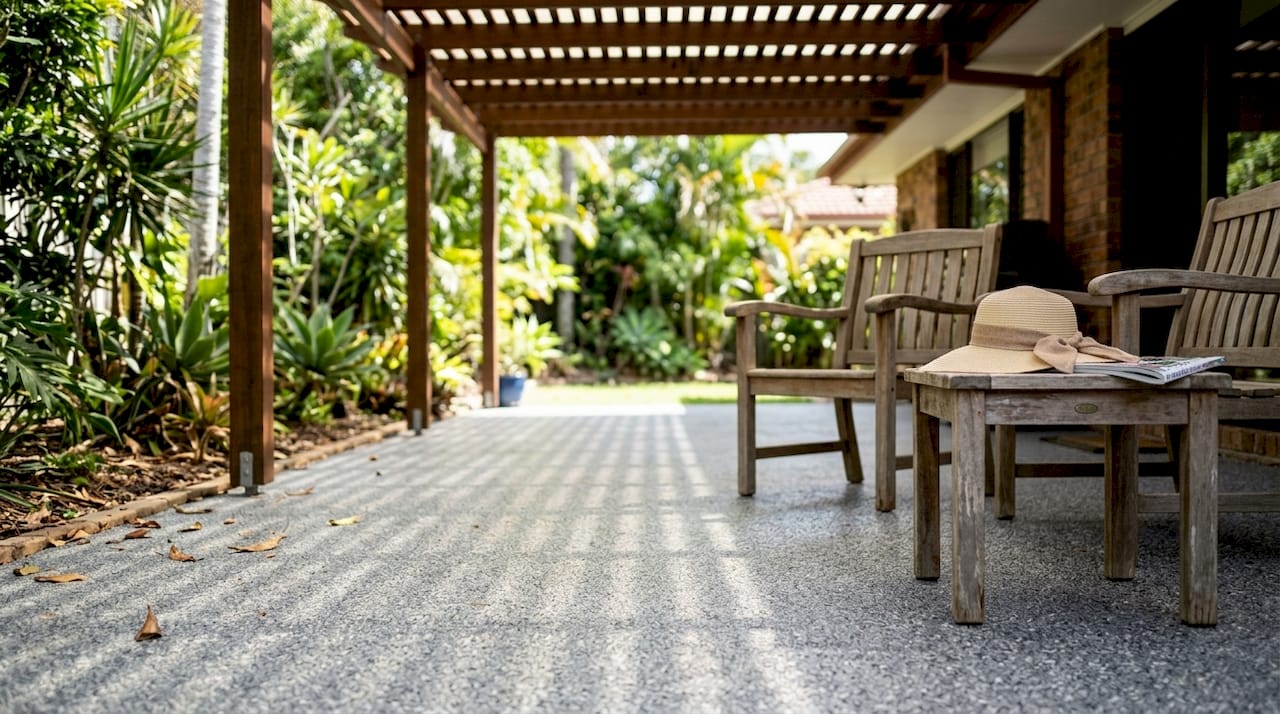 Flake epoxy floor on Queensland patio with chairs