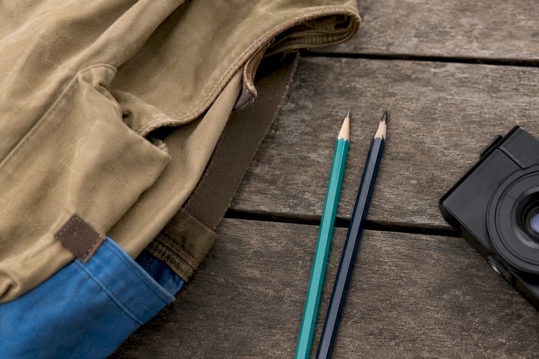Pencils and camera arranged for field sketching