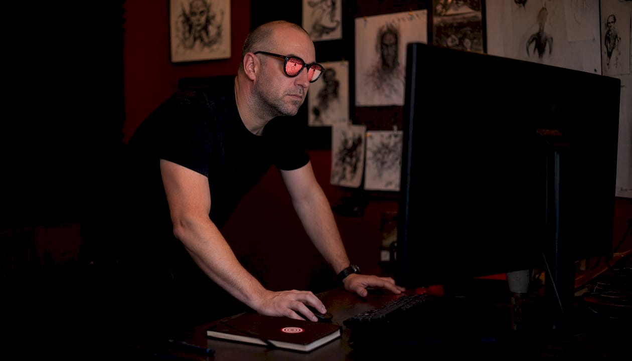 Film director reviewing horror symbolism footage