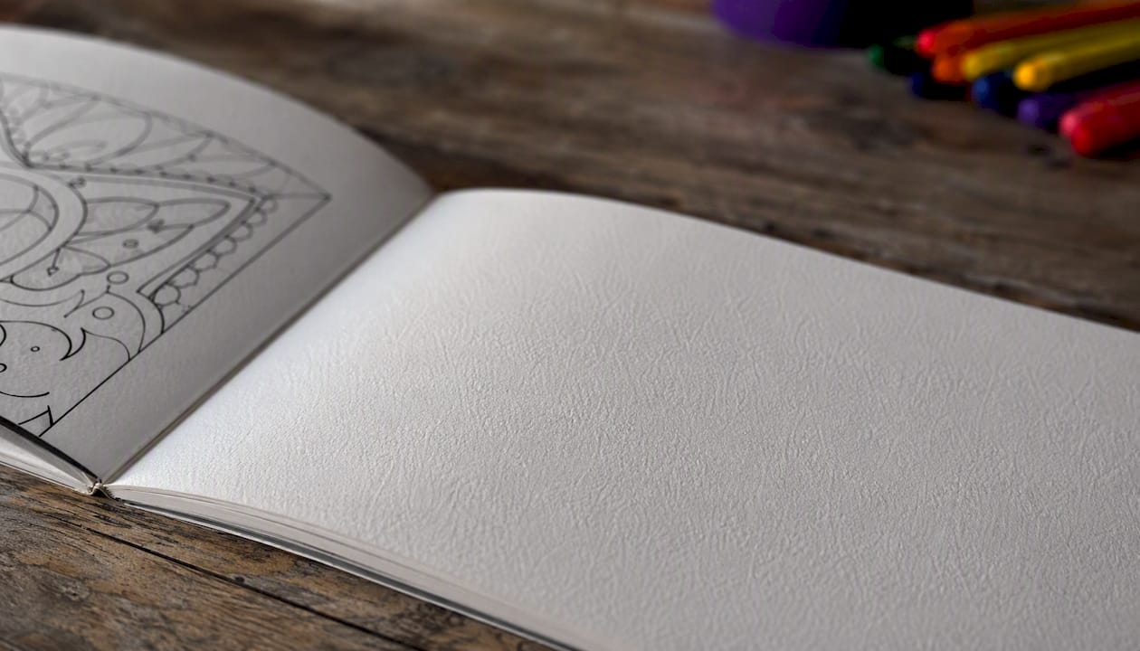 Close-up of uncoated coloring book paper and binding