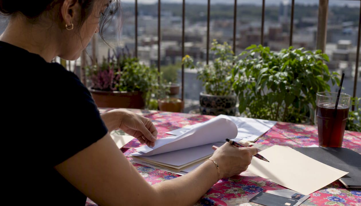 Renter organizing rental application documents