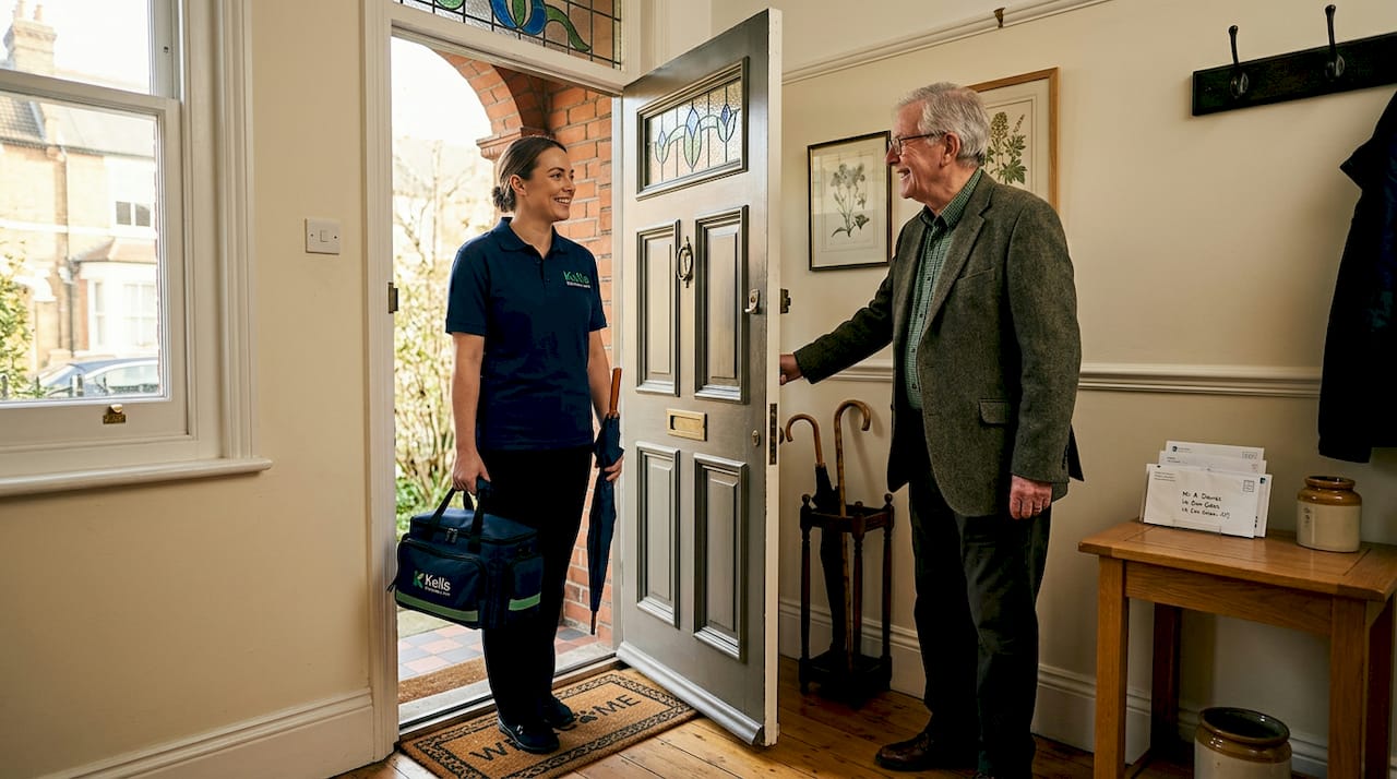 Carer arrives to greet client at London home