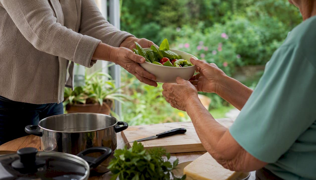 Carer supporting family meal preparation